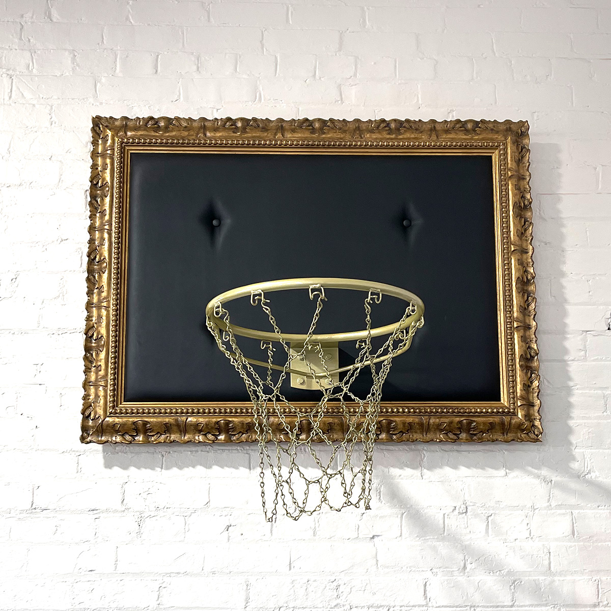 Hoop framed with ornate gold frame